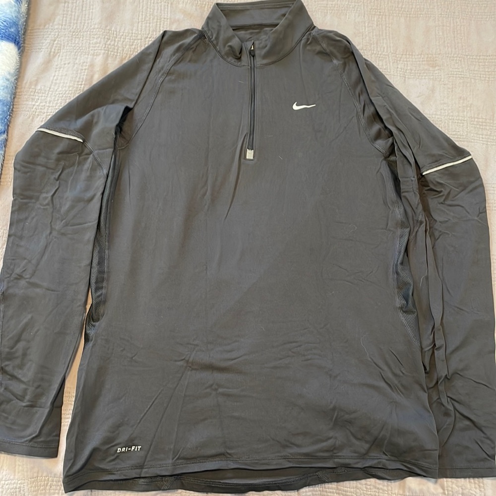 Nike dry fit pull over 1/4 zip. Great for running/hiking. Lightly used.